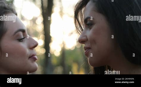 lesbian kissing hd|Two girls french kissing outside at the park. LGBT lesbian couple。